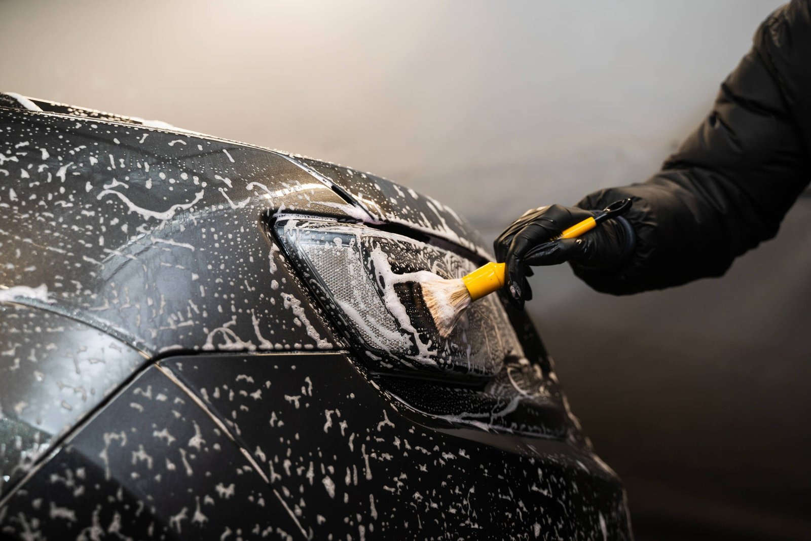cleaning headlights with foam soft brush carwash detailing manual cleaning with soap self care car wash scaled