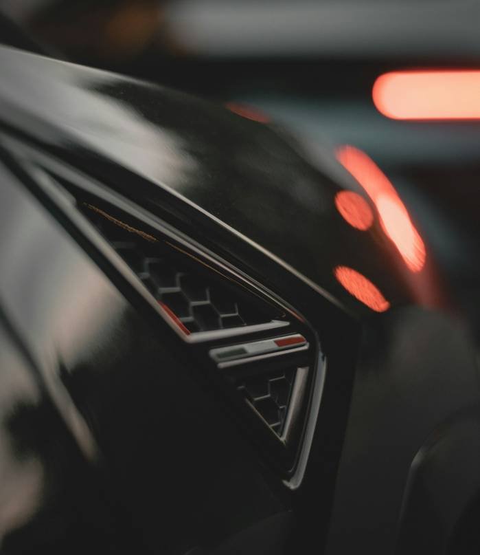 Vertical closeup of the luxury black car details